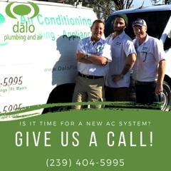 DALO Plumbing & Air team standing in front of branded service van — Is it time for a new air conditioning system? Give us a call!